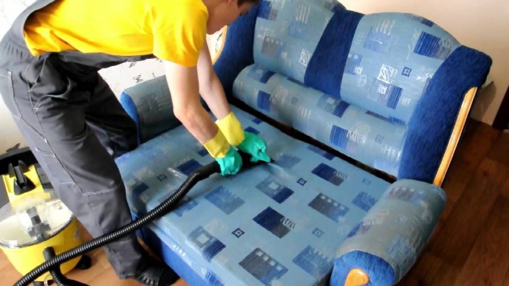 Cleaning a sofa with a steam cleaner