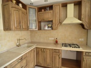 The color of the walls in the kitchen with brown furniture