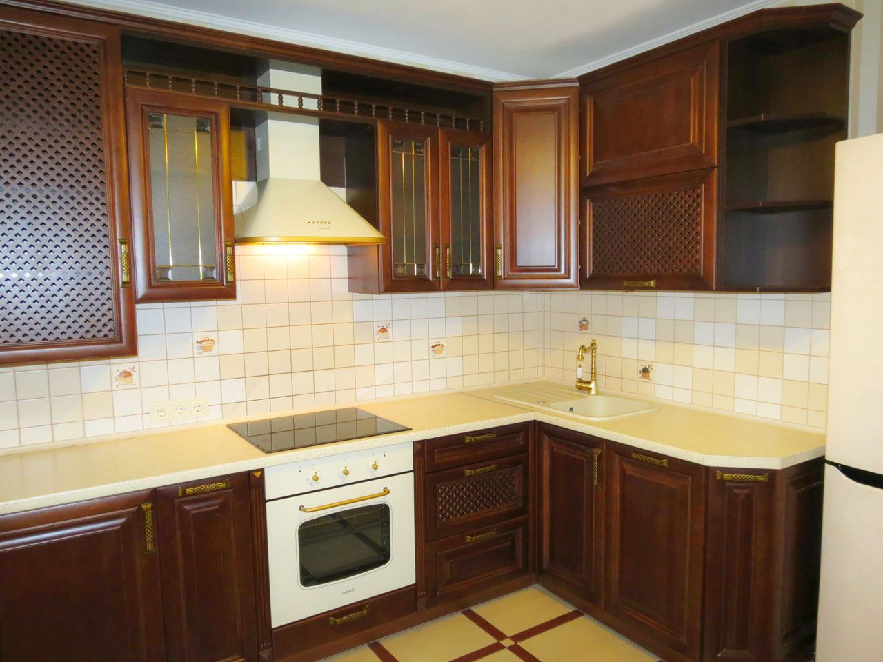 The color of the walls in the kitchen with brown furniture