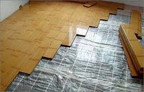 Infrared heated floor under laminate