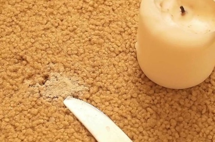 Cleaning carpet from wax stains.