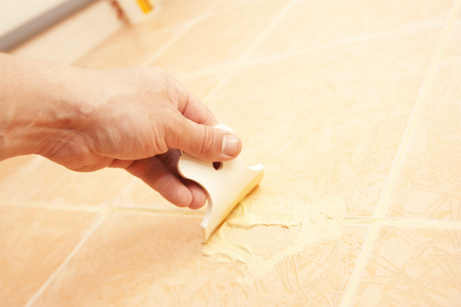 Filling chips on tiles.