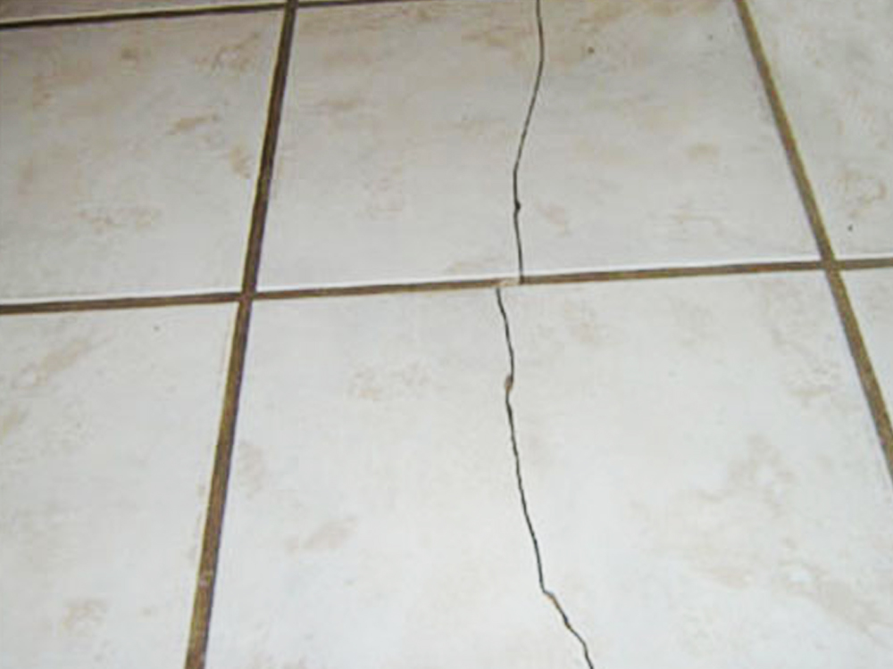 Cracks on the tiles.