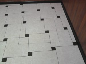 Laying ceramic tiles on the floor 