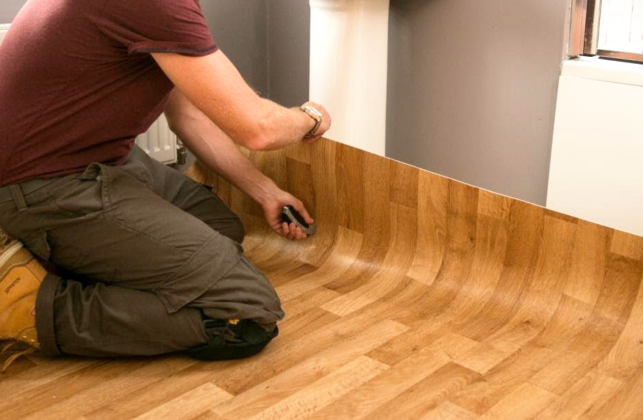 Laying linoleum on a parquet board.