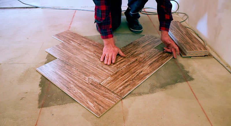 Laying tiles in a herringbone pattern