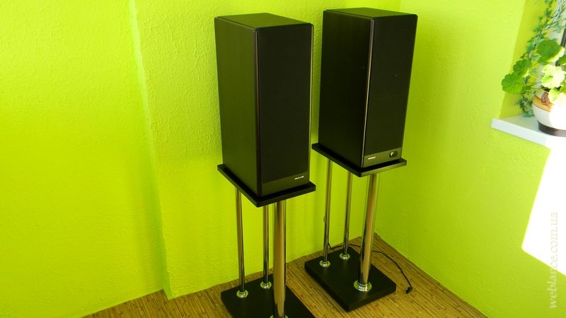 The speakers are on a stand