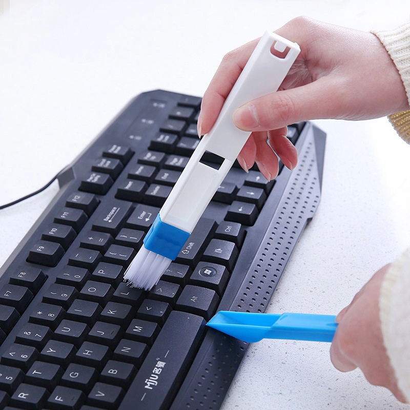 Cleaning the keyboard using a special brush.