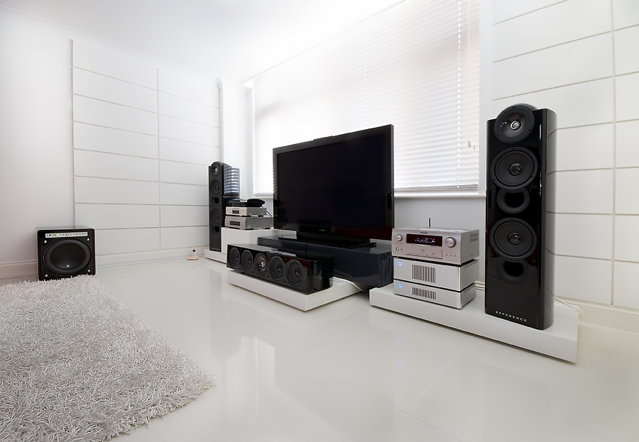 Amplifier with speakers in the room.