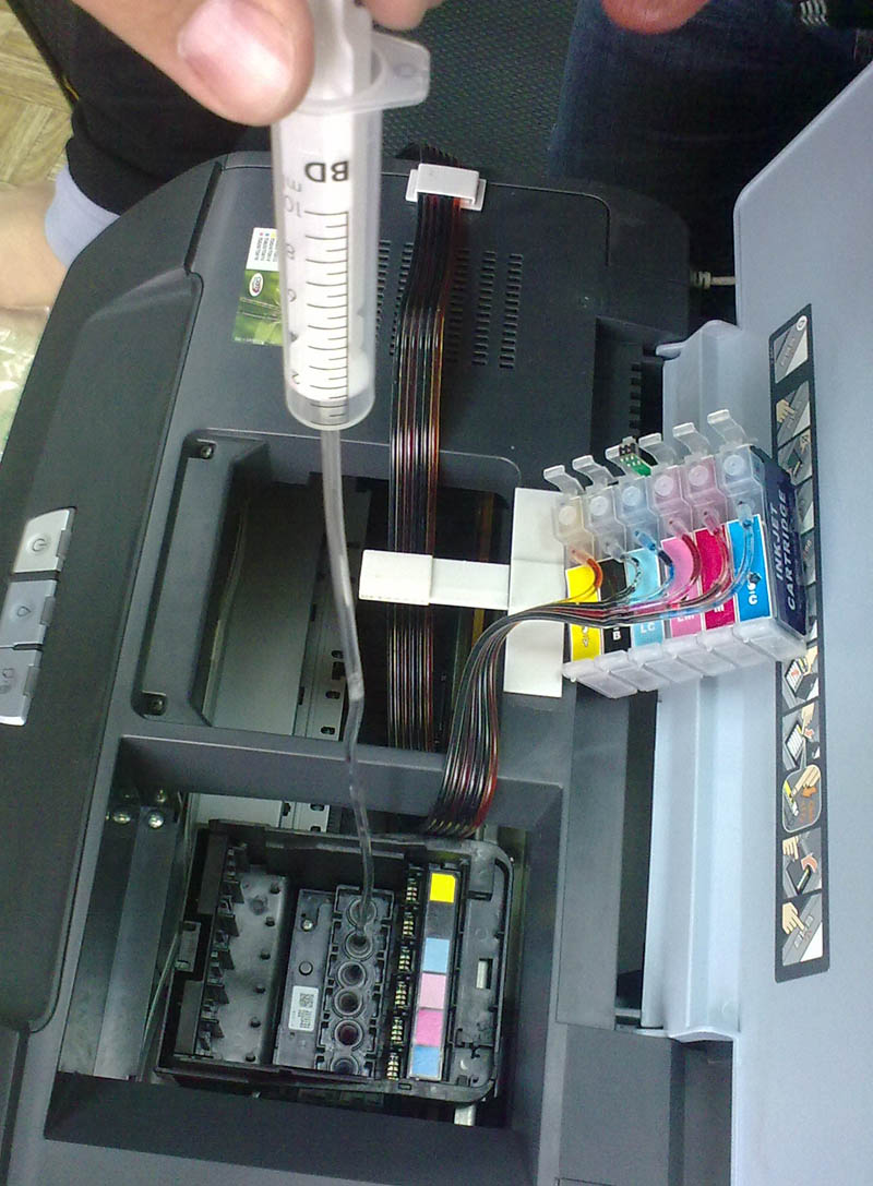 Cleaning the print head of an inkjet printer.