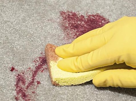 Wine and blood stains on the carpet