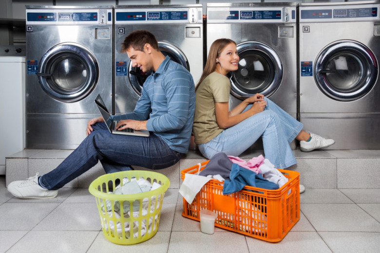 Why do Americans wash in laundries and not at home?