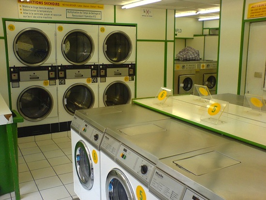 Why do Americans wash in laundries and not at home?