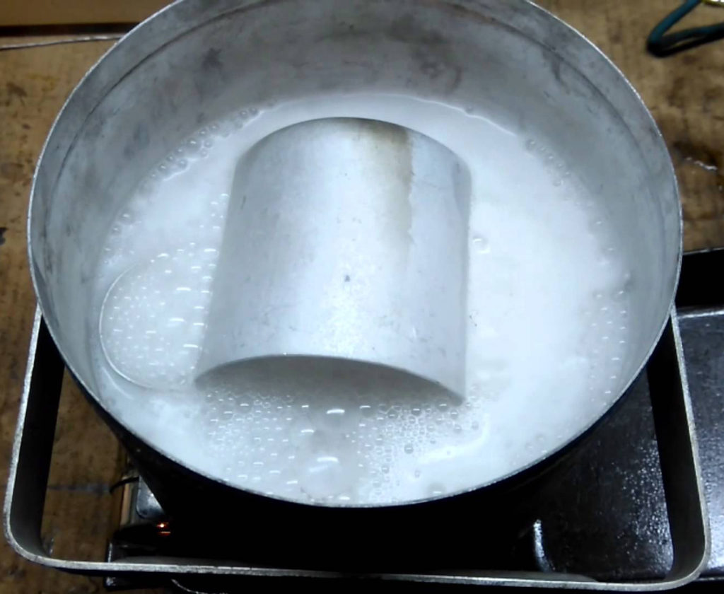 Boiling a pot in a basin.