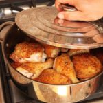 Frying meat in a pan.