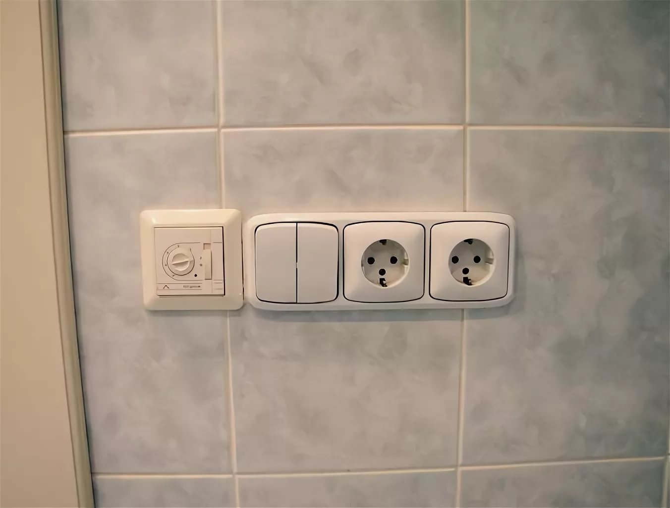 Why in America are the bathroom switches inside, but in ours are they outside?