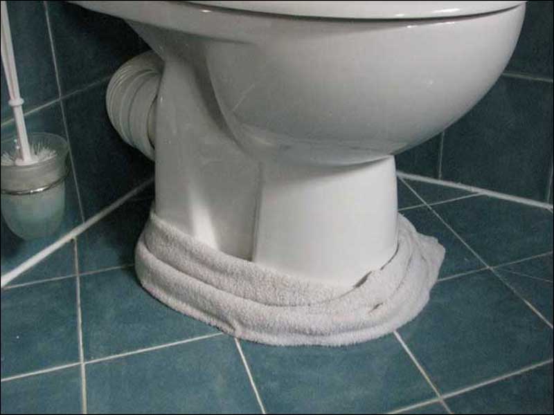 The toilet tank is leaking.