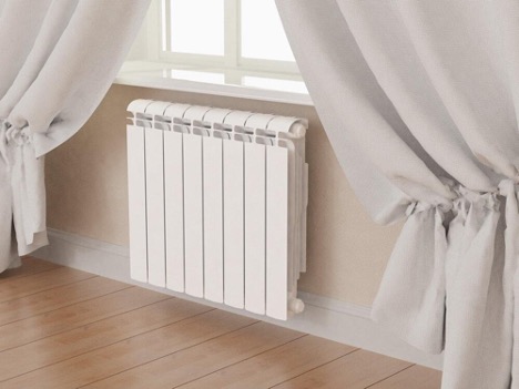 Hoe een verwarmingsradiator aan beugels te hangen